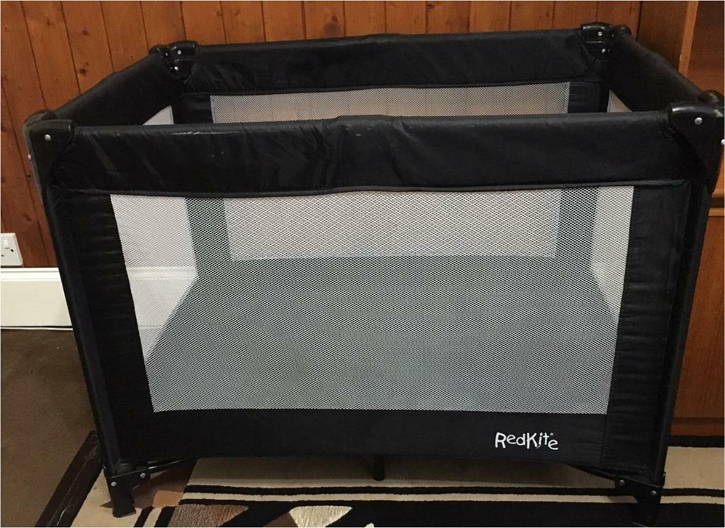 red kite travel cot black